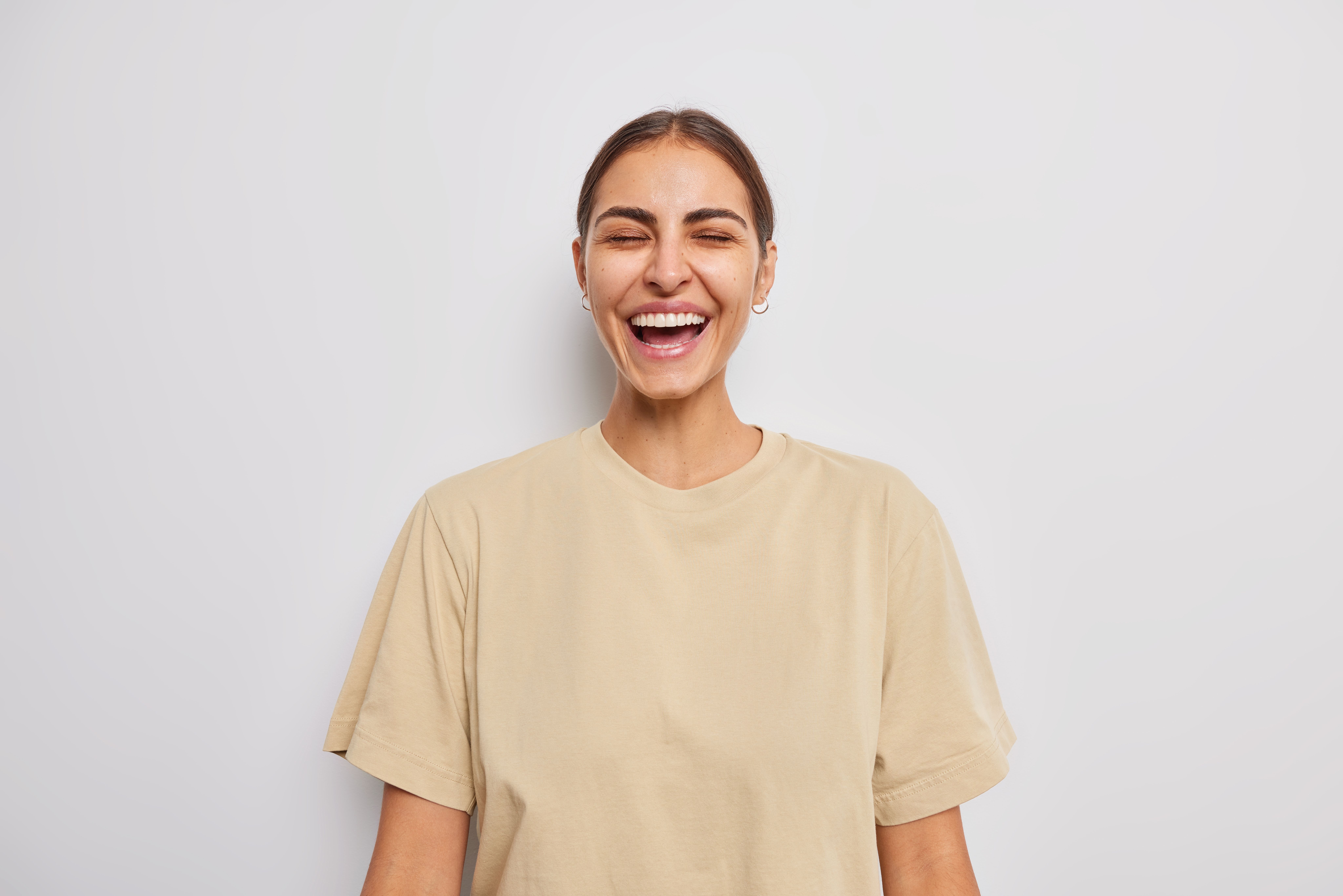 A young woman smiling warmly